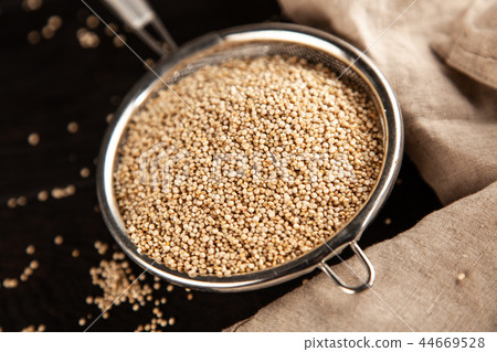 Raw quinoa seeds in a glass jar 44669528