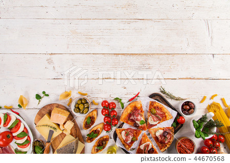 Italian food ingredients on old wooden background Italian food ingredients on old wooden background 44670568