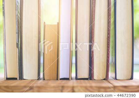 Stack Of Thick Books With Beautiful Light 44672390