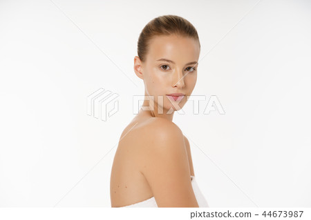 Beautiful girl with nude make up posing at white grey studio background, beauty photo concept 44673987