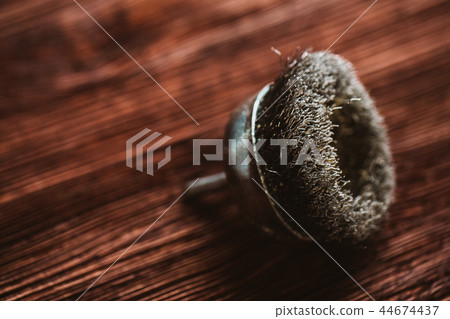 Brush drill on a dark wooden background Brush drill on a dark wooden background 44674437