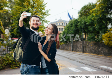 Young couple doing selfie Young couple doing selfie 44676511