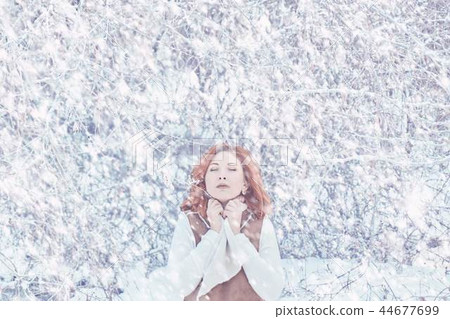 Woman walking in winter in the forest. 44677699