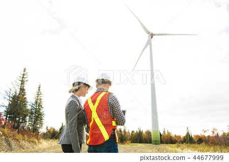 A Technician team Engineer in Wind Turbine Power Generator Station A Technician team Engineer in Wind Turbine Power Generator Station 44677999