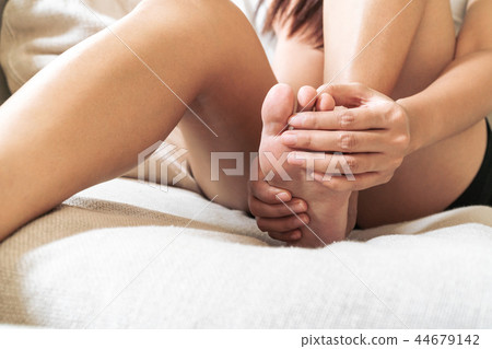 foot ankle injury pain women touch foot painful 44679142