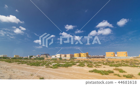 Cityscape of Ajman with villas ready and under constroction timelapse. Ajman is the capital of the emirate of Ajman in the United Arab Emirates. 44681618