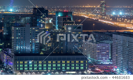 Aerial skyline of Abu Dhabi city centre from above night timelapse 44681683