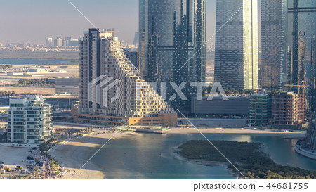 Buildings on Al Reem island in Abu Dhabi timelapse from above. 44681755