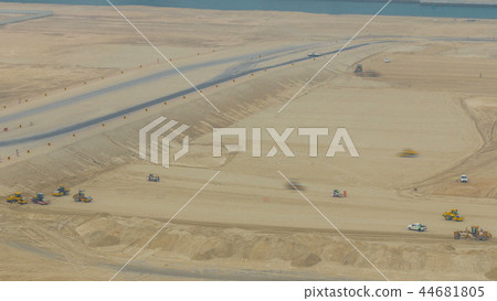 Soil compactor and bulldozer during road construction works timelapse 44681805