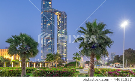 Skyscrapers of Abu Dhabi illuminated with Nation towers buildings day to night transition timelapse. Skyscrapers of Abu Dhabi illuminated with Nation towers buildings day to night transition timelapse. 44681837