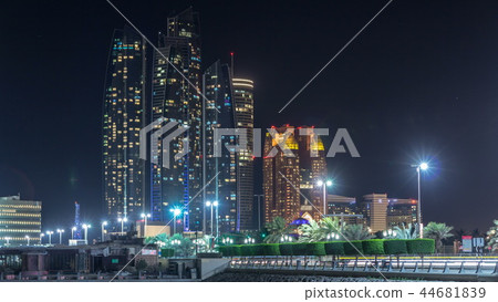 Skyscrapers of Abu Dhabi at night with Etihad Towers buildings timelapse. 44681839
