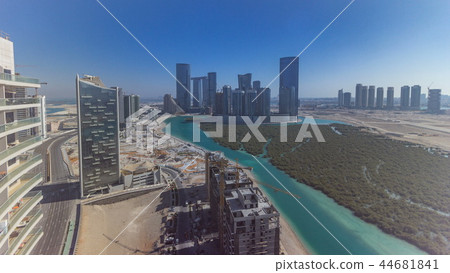Buildings on Al Reem island in Abu Dhabi timelapse from above. Buildings on Al Reem island in Abu Dhabi timelapse from above. 44681841