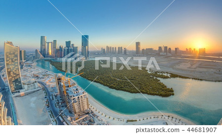 Buildings on Al Reem island in Abu Dhabi at sunset timelapse from above. 44681907