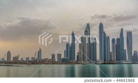 Panorama of modern skyscrapers in Dubai city at sunrise timelapse from the Palm Jumeirah Island. 44681988