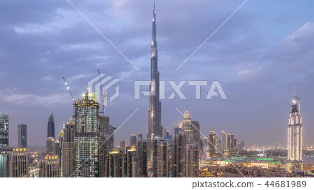 Dobai Downtown day to night timelapse. Aerial view over big futuristic city by night. 44681989