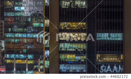 Scenic glowing windows of skyscrapers at evening timelapse Scenic glowing windows of skyscrapers at evening timelapse 44682172