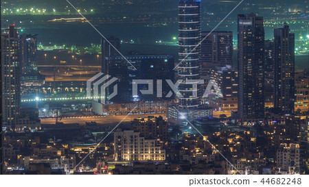 Dubai Downtown night timelapse modern towers panoramic view from the top in Dubai, United Arab Emirates. Dubai Downtown night timelapse modern towers panoramic view from the top in Dubai, United Arab Emirates. 44682248