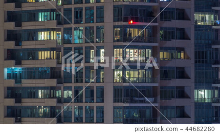 Glowing windows of skyscrapers at evening timelapse 44682280