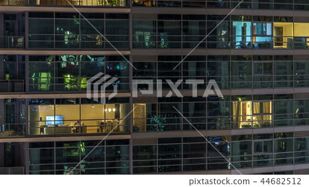 Glowing windows of skyscrapers at evening timelapse 44682512