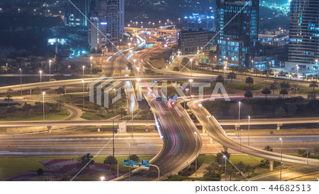 Aerial view of a road intersection in a big city night timelapse. 44682513