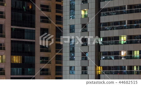 Scenic glowing windows of skyscrapers at evening timelapse Scenic glowing windows of skyscrapers at evening timelapse 44682515