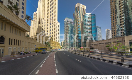 A view of traffic on the street at Jumeirah Beach Residence and Dubai marina timelapse hyperlapse, United Arab Emirates. A view of traffic on the street at Jumeirah Beach Residence and Dubai marina timelapse hyperlapse, United Arab Emirates. 44682568