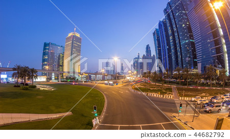 Traffic on intersection and bridge at the Sheikh Zayed Road day to night timelapse Traffic on intersection and bridge at the Sheikh Zayed Road day to night timelapse 44682792