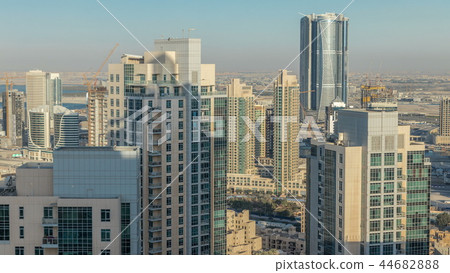 Dubai downtown in the evening timelapse in bright yellow sunset light 44682888