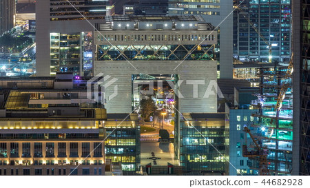 Skyline view of the buildings of Sheikh Zayed Road and DIFC night timelapse in Dubai, UAE. Skyline view of the buildings of Sheikh Zayed Road and DIFC night timelapse in Dubai, UAE. 44682928