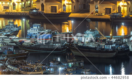 Loading a ship in Port Said night timelapse in Dubai, UAE. Loading a ship in Port Said night timelapse in Dubai, UAE. 44682958