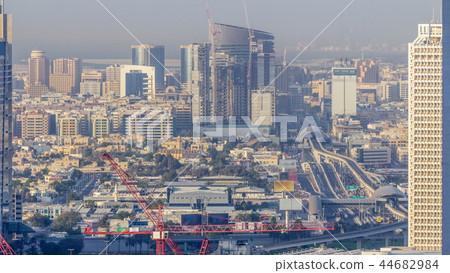 Skyline view of the buildings of Sheikh Zayed Road and DIFC timelapse in Dubai, UAE. Skyline view of the buildings of Sheikh Zayed Road and DIFC timelapse in Dubai, UAE. 44682984