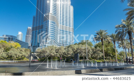 Fountains near main entrance to the tallest skyscraper timelapse, Dubai 44683025