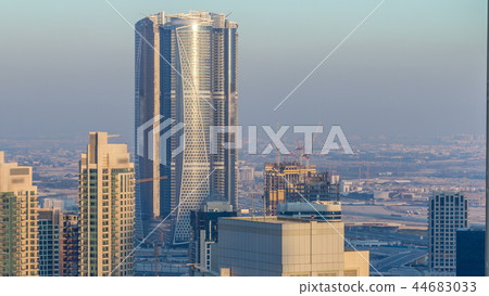 Dubai downtown in the evening timelapse in bright yellow sunset light Dubai downtown in the evening timelapse in bright yellow sunset light 44683033