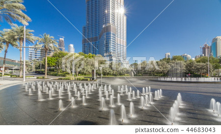 Fountains near main entrance to the tallest skyscraper timelapse hyperlapse, Dubai 44683043