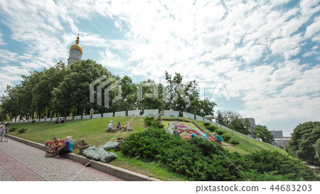 The bell tower of the Assumption Cathedral Uspenskiy Sobor timelapse hyperlapse with flowerbed, Kharkov, Ukraine. The bell tower of the Assumption Cathedral Uspenskiy Sobor timelapse hyperlapse with flowerbed, Kharkov, Ukraine. 44683203