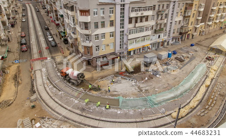 Concrete works for road maintenance construction with many workers and mixer timelapse 44683231