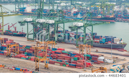 Commercial port of Singapore timelapse. Bird eye panoramic view of busiest Asian cargo port 44683401