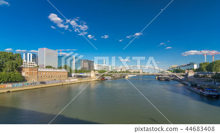 The Austerlitz viaduct in Paris timelapse hyperlapse, seen from bank of the river Seine with a metro train passing The Austerlitz viaduct in Paris timelapse hyperlapse, seen from bank of the river Seine with a metro train passing 44683408