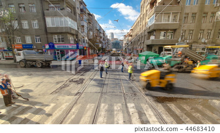 Tractor, roller on the road repair site timelapse. Road construction equipment. 44683410