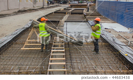 Concrete works for road maintenance construction with many workers and mixer timelapse Concrete works for road maintenance construction with many workers and mixer timelapse 44683438
