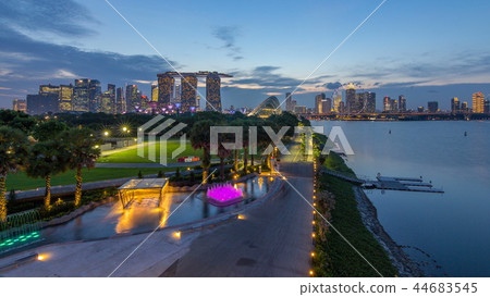 Marina Bay Sands, Gardens by the bay with cloud forest, flower dome and supertrees day to night timelapse after sunset Marina Bay Sands, Gardens by the bay with cloud forest, flower dome and supertrees day to night timelapse after sunset 44683545