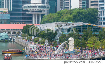 Merlion lion fountain sculpture with financial towers on background timelapse. Merlion lion fountain sculpture with financial towers on background timelapse. 44683553