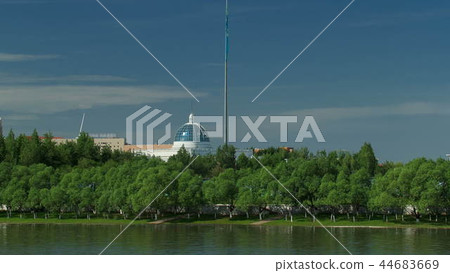 river Ishim timelapse, buildings, premises, tratuar and trees in park. Sunny day. Astana, Kazakhstan 44683669