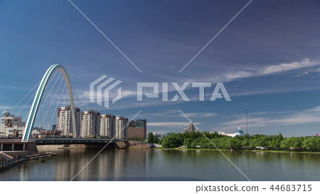 Bridge over Ishim with park timelapse with the transport and clouds on the background. Central Asia, Kazakhstan, Astana 44683715
