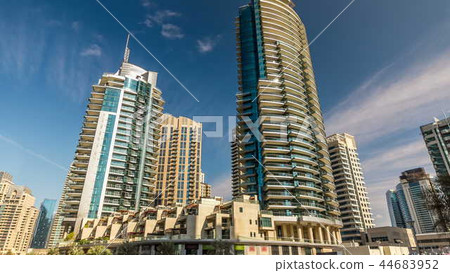 View of Dubai Marina modern Towers in Dubai at day time timelapse 44683952