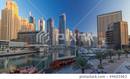 Morning view of Dubai Marina Towers and canal in Dubai timelapse Morning view of Dubai Marina Towers and canal in Dubai timelapse 44683963