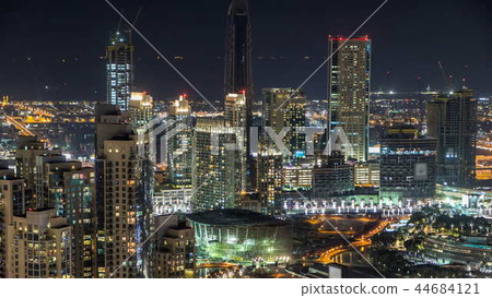 Towers and park near man-made lake timelapse in Dubai downtown, United Arab Emirates. 44684121