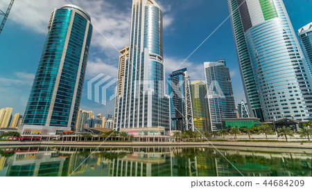 Residential buildings in Jumeirah Lake Towers timelapse hyperlapse in Dubai, UAE. 44684209