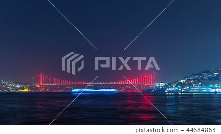 Illuminated bridge over Bosphorus night timelapse. Turkey renames Bosporus Bridge "15th July Martyrs Bridge". Istanbul Turkey. 44684863