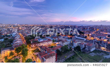 Rooftops of Porto's old town on a warm spring day timelapse day to night, Porto, Portugal 44685927